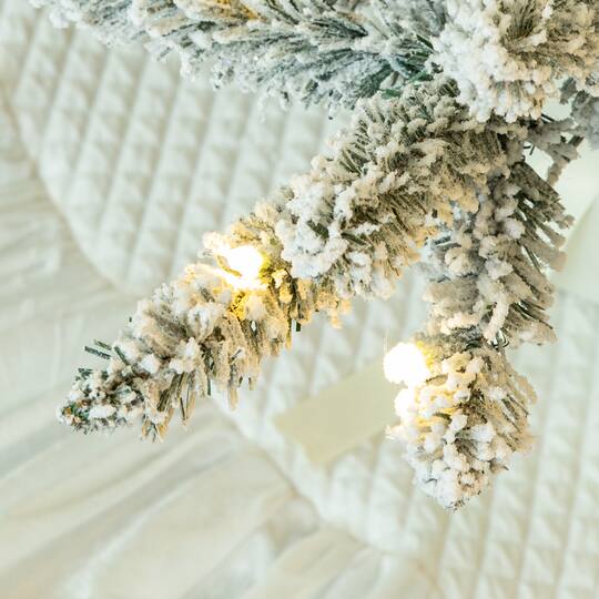 10ft. Pre-Lit Flocked Full Fir Artificial Christmas Tree, Warm White LED Lights